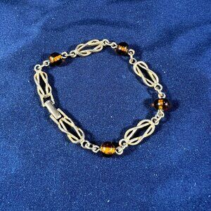 Avon Gold & Amber Empowerment Bracelet With Infinity Symbol Design